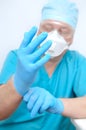 The doctor put on sterile gloves. Preparing for surgery Royalty Free Stock Photo
