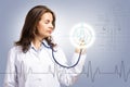 Doctor put a stethoscope to the glowing dashboard Royalty Free Stock Photo