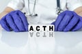 The doctor put together a word from cubes ACTH. Adrenocorticotropic Hormone
