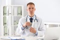 Doctor putting bribe into pocket. Corrupted medicine Royalty Free Stock Photo
