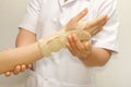 Doctor putting wrist brace Royalty Free Stock Photo