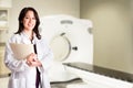 Doctor radiologist at CT CAT scan with chart Royalty Free Stock Photo