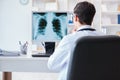The doctor radiologist looking at x-ray images Royalty Free Stock Photo