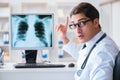 The doctor radiologist looking at x-ray images Royalty Free Stock Photo