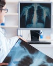 Doctor radiologist looking at x-ray images Royalty Free Stock Photo