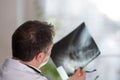 Doctor reading X-ray images Royalty Free Stock Photo