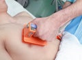 Doctor reanimates patient by an electrical defibrillator