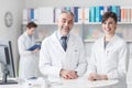 Doctor at the reception desk with his assistant Royalty Free Stock Photo