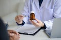 Doctor are recommending medicines to patients after being examined and diagnosed by the patient's doctor Royalty Free Stock Photo