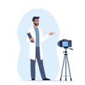 Doctor records video with training medical lecture, standing in front of the camera. Online medical seminar, lecture, healthcare