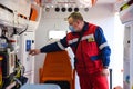 Poltava, Ukraine - 29 April, 2021:Doctor in a red medical uniform in an ambulance