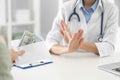 Doctor rejecting bribe in clinic. Corrupted medicine Royalty Free Stock Photo