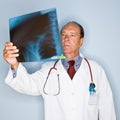 Doctor reviewing x-rays Royalty Free Stock Photo