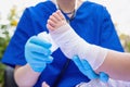 Doctor Rewinds Leg of Small Girl with Bandage. kid`s foot was treated bandaging patient`s leg by a doctor Royalty Free Stock Photo