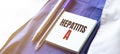 Doctor robe, stethoscope, pens and note with text HEPATITIS A Royalty Free Stock Photo