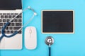 Doctor`s Day concept, flat lay top view, stethoscope with laptop computer and black board diagnosis of heart disease Royalty Free Stock Photo