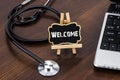 The doctor`s desk with stethoscope and red heart and blackboard Royalty Free Stock Photo