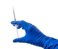 Doctor`s hand in blue medical glove holding open syringe with medical solution isolated white background. Flu vaccine Royalty Free Stock Photo