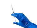 Doctor`s hand in blue medical glove holding open syringe with medical solution isolated white background. Flu vaccine Royalty Free Stock Photo