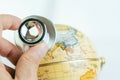 Doctor`s hand holding stethoscope inspecting on globe with China map on white background using as ecology world environment or