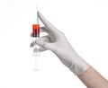 Doctor's hand holding a syringe, white gloved hand, a large syringe, the doctor makes an injection, white background