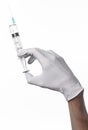 Doctor's hand holding a syringe, white-gloved hand, a large syringe, medical issue, the doctor makes an injection