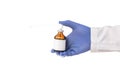 Doctor`s hand holds in hand a local anesthesia freeze for pain relief on a white background, isolate. Dentistry anesthesia concep