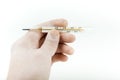 Doctor`s hand in latex white glove holding an analog thermometer Royalty Free Stock Photo