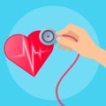 Doctor`s hand with stethoscope and heart with pulse line. Royalty Free Stock Photo