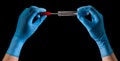 Doctor`s hands in medical gloves holding test tube with coronavirus COVID-19 Royalty Free Stock Photo