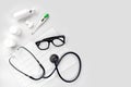 Doctor`s office desk with medical documents, charts, eyeglasses and stethoscope. Top view. Copy space Royalty Free Stock Photo