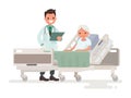 Doctor`s visit to the ward of patient elderly woman lying in a