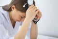 Doctor. Sad or crying female nurse at hospital office Royalty Free Stock Photo