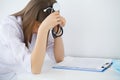 Doctor. Sad or crying female nurse at hospital office Royalty Free Stock Photo