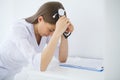 Doctor. Sad or crying female nurse at hospital office Royalty Free Stock Photo