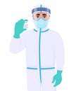 Doctor in safety protective suit clothing and showing vaccine bottle. Medical person wearing face shield. Professional physician