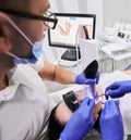 Doctor scanning patient mouth with modern intraoral scanner. Royalty Free Stock Photo