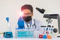 A doctor or scientist holding a lamp in a laboratory Virus fighting concept. Corona virus, infectious disease, medicine, science a