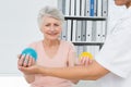 Doctor with senior patient using stress buster balls Royalty Free Stock Photo