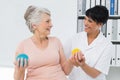 Doctor with senior patient using stress buster balls Royalty Free Stock Photo