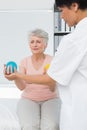 Doctor with senior patient using stress buster balls Royalty Free Stock Photo