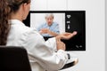 Doctor and senior woman taking the pulse, telemedicine and video Royalty Free Stock Photo