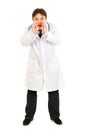 Doctor shouting through megaphone shaped hands Royalty Free Stock Photo