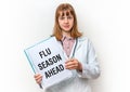 Doctor showing clipboard with written text: Flu Season Ahead Royalty Free Stock Photo