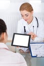 Doctor showing digital tablet to patient Royalty Free Stock Photo