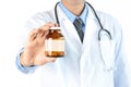 Doctor showing drug or medicine bottle with blank label Royalty Free Stock Photo