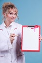 Doctor showing folder with pink ribbon by pen. Royalty Free Stock Photo