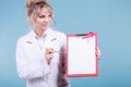 Doctor showing folder with pink ribbon by pen. Royalty Free Stock Photo