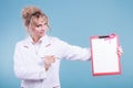 Doctor showing folder with pink ribbon by pen. Royalty Free Stock Photo