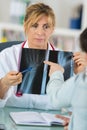 doctor showing hand xray to patient Royalty Free Stock Photo